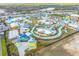 Aerial view of a vibrant water park filled with colorful slides, pools, and attractions, offering a fun-filled experience at 3036 Parrot Head Pl, Kissimmee, FL 34747