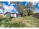 View of the backyard showing ample space, trees, and a fence, offering privacy and plenty of room to enjoy outdoors at 3403 Canute Pl, Orlando, FL 32818