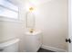 Small bathroom with white sink and cabinet with modern gold fixtures at 3403 Canute Pl, Orlando, FL 32818