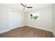 Bright bedroom featuring a window and durable wood flooring at 3403 Canute Pl, Orlando, FL 32818