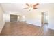 Spacious living room with new flooring, a modern ceiling fan, and recessed lighting at 3403 Canute Pl, Orlando, FL 32818