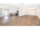 Open-concept living space featuring new hardwood floors, a modern kitchen, and plenty of natural light at 3403 Canute Pl, Orlando, FL 32818