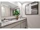 Well-lit bathroom with double sinks, granite countertops, and modern fixtures for a luxurious feel at 3438 Briarwood Grove Dr, Ocoee, FL 34761