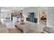 Inviting living space with a seamless flow between the kitchen, dining, and relaxation areas at 3438 Briarwood Grove Dr, Ocoee, FL 34761