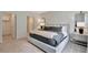 Serene main bedroom featuring a plush bed, elegant wall decor, and ample natural light at 3438 Briarwood Grove Dr, Ocoee, FL 34761