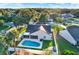 Aerial view of the property showcasing the pool, fenced yard, and convenient outdoor living spaces at 3499 Woodley Park Pl, Oviedo, FL 32765