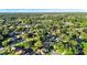 Expansive aerial shot showcasing a community with verdant trees, tranquil ponds, and attractive homes at 3499 Woodley Park Pl, Oviedo, FL 32765