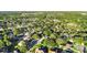 A panoramic aerial perspective of a community featuring mature trees and meticulously kept yards at 3499 Woodley Park Pl, Oviedo, FL 32765