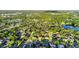 Picturesque aerial view featuring lush greenery, serene lakes, and a well-planned residential area at 3499 Woodley Park Pl, Oviedo, FL 32765