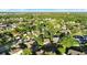 Neighborhood aerial shot with marker; houses surrounded by trees, some with screened patios at 3499 Woodley Park Pl, Oviedo, FL 32765