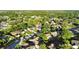 Scenic aerial shot features a leafy residential area with well-kept homes and landscaping at 3499 Woodley Park Pl, Oviedo, FL 32765