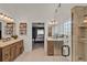 Spacious bathroom with double vanity, glass shower enclosure, and direct access to the main bedroom at 3499 Woodley Park Pl, Oviedo, FL 32765