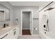 Well lit bathroom featuring white cabinets, new shower fixtures, and a large vanity at 3499 Woodley Park Pl, Oviedo, FL 32765
