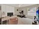 Bedroom featuring a desk, modern furniture, large closets, carpet and access to a window at 3499 Woodley Park Pl, Oviedo, FL 32765