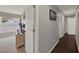 Hallway featuring hard wood floors, modern paint, and access to a bedroom with lots of natural light at 3499 Woodley Park Pl, Oviedo, FL 32765