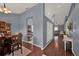 Open-concept interior featuring hardwood floors, stylish wall colors, and seamless transitions into the dining and living areas at 3499 Woodley Park Pl, Oviedo, FL 32765