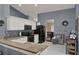 Stylish kitchen with white cabinetry, granite countertops, and stainless steel appliances at 3499 Woodley Park Pl, Oviedo, FL 32765