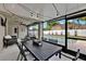 Covered patio with outdoor dining, lounge furniture, ceiling fan and access to the pool, perfect for relaxation at 3499 Woodley Park Pl, Oviedo, FL 32765