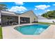 A luxurious pool with an adjacent screened-in porch with plenty of seating and outdoor entertaining space at 3499 Woodley Park Pl, Oviedo, FL 32765