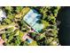 Aerial view of community amenities with playground, tennis court, basketball court and landscaping at 356 Remington Dr, Oviedo, FL 32765