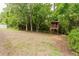 Spacious backyard with a custom-built treehouse and ample space for outdoor activities and play at 356 Remington Dr, Oviedo, FL 32765