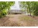 Expansive backyard with a screened enclosure, providing a perfect space for outdoor entertainment and relaxation at 356 Remington Dr, Oviedo, FL 32765