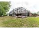 Aerial view of spacious backyard with fenced-in pool area, mature trees, and privacy at 356 Remington Dr, Oviedo, FL 32765
