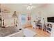 Charming bedroom with hardwood floors, bright window, and desk area with good natural lighting at 356 Remington Dr, Oviedo, FL 32765