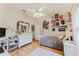 Cozy bedroom with hardwood floors, comfortable bed, and decorative elements at 356 Remington Dr, Oviedo, FL 32765
