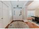 Bright foyer with tile floors, decorative rug, and a view into the dining area at 356 Remington Dr, Oviedo, FL 32765