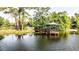Scenic lake view with gazebo on a pier extending into the water, surrounded by trees at 356 Remington Dr, Oviedo, FL 32765