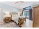 Serene main bedroom with neutral wall color, hardwood floors, and sliding glass doors to a private patio at 356 Remington Dr, Oviedo, FL 32765