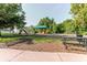 Community playground featuring slides, swings, and a picnic table for fun and relaxation at 356 Remington Dr, Oviedo, FL 32765