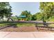 Community playground featuring slides, swings, and a picnic table for fun and relaxation at 356 Remington Dr, Oviedo, FL 32765
