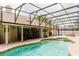 Inviting backyard pool with a covered patio and comfortable lounge seating at 356 Remington Dr, Oviedo, FL 32765