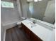 Bathroom boasts a modern vanity, toilet, and bathtub-shower combo at 3707 Andover Cay Blvd, Orlando, FL 32825