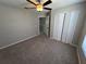 Bedroom featuring a ceiling fan and double door closet at 3707 Andover Cay Blvd, Orlando, FL 32825