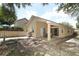 Backyard view showcasing a covered patio with ample seating space, perfect for outdoor entertaining at 4035 Palo Alto Ct, Orlando, FL 32817