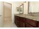 Bathroom featuring double vanity with granite counters and tile floors at 4035 Palo Alto Ct, Orlando, FL 32817