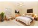 Relaxing bedroom with neutral walls, tile floors, and large windows at 4035 Palo Alto Ct, Orlando, FL 32817