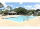 Relaxing community pool surrounded by lounge chairs, promising endless summer fun at 4035 Palo Alto Ct, Orlando, FL 32817