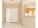 Bright entryway with tile flooring offering views into the kitchen and living areas, creating an open flow at 4035 Palo Alto Ct, Orlando, FL 32817