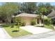 Inviting single-Gathering home featuring a well-manicured front yard, attached garage, and classic residential charm at 4035 Palo Alto Ct, Orlando, FL 32817