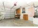 Garage with shelving, work bench, and water heater at 4035 Palo Alto Ct, Orlando, FL 32817
