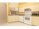 Functional kitchen with white appliances, ample cabinet space, and an open layout for easy meal preparation at 4035 Palo Alto Ct, Orlando, FL 32817