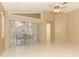 Bright living area with sliding glass doors offering natural light, along with a ceiling fan and neutral decor at 4035 Palo Alto Ct, Orlando, FL 32817