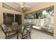 Enclosed patio with a table and chairs, perfect for outdoor dining at 4035 Palo Alto Ct, Orlando, FL 32817