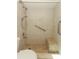Tiled walk-in shower with a built-in bench and accessibility grab bars at 4035 Palo Alto Ct, Orlando, FL 32817