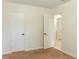 Bedroom showcasing neutral carpet and access to the en-suite bathroom and closet at 409 E Gulley Ave, Oakland, FL 34760
