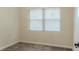 Bedroom featuring neutral carpet and a window with bright natural light at 409 E Gulley Ave, Oakland, FL 34760